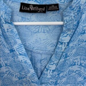 Liza Byrd Light Blue Patterned woman’s Shirt…longer in back